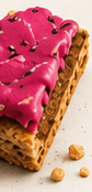 An industrially made bar with thick pink icing